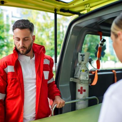 Two Paramedics With Stretcher Near Ambulance Paramedics Uniform Taking Stretcher Out Ambulance Car